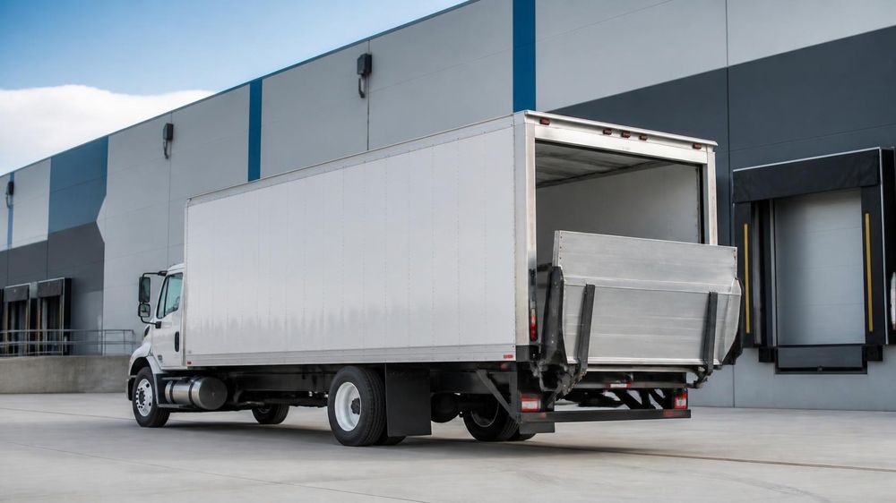 26ft box truck with hydraulic liftgate at a loading dock